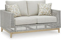 Signature Design by Ashley Seton Creek Cottage Nuvella Weather Resistant Fabric Outdoor Loveseat with Cushion and 2 Throw Pillows, Light Brown & Light Gray